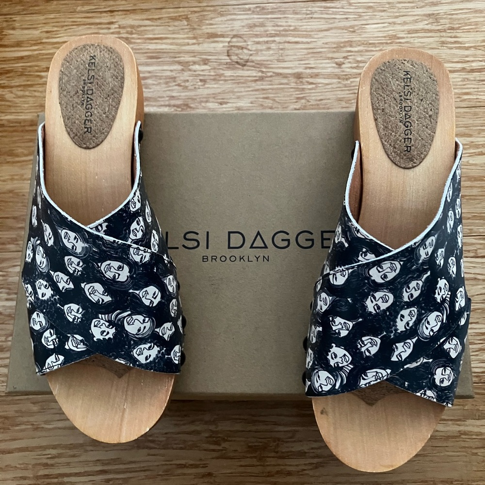 Kelsi Dagger Black and white “women’s faces” print sandal with wooden platform